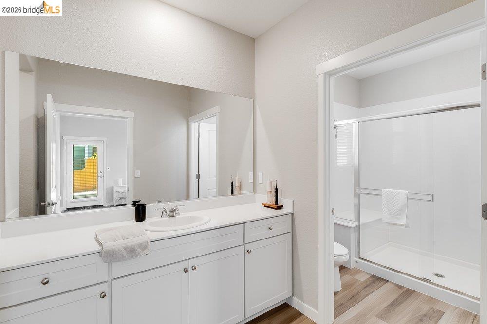 4347 Canada Way Rio Vista, CA 94571 - Photo 24 of 41 Bathroom featuring a long vanity with a single sink, light-colored countertops, and white cabinetry