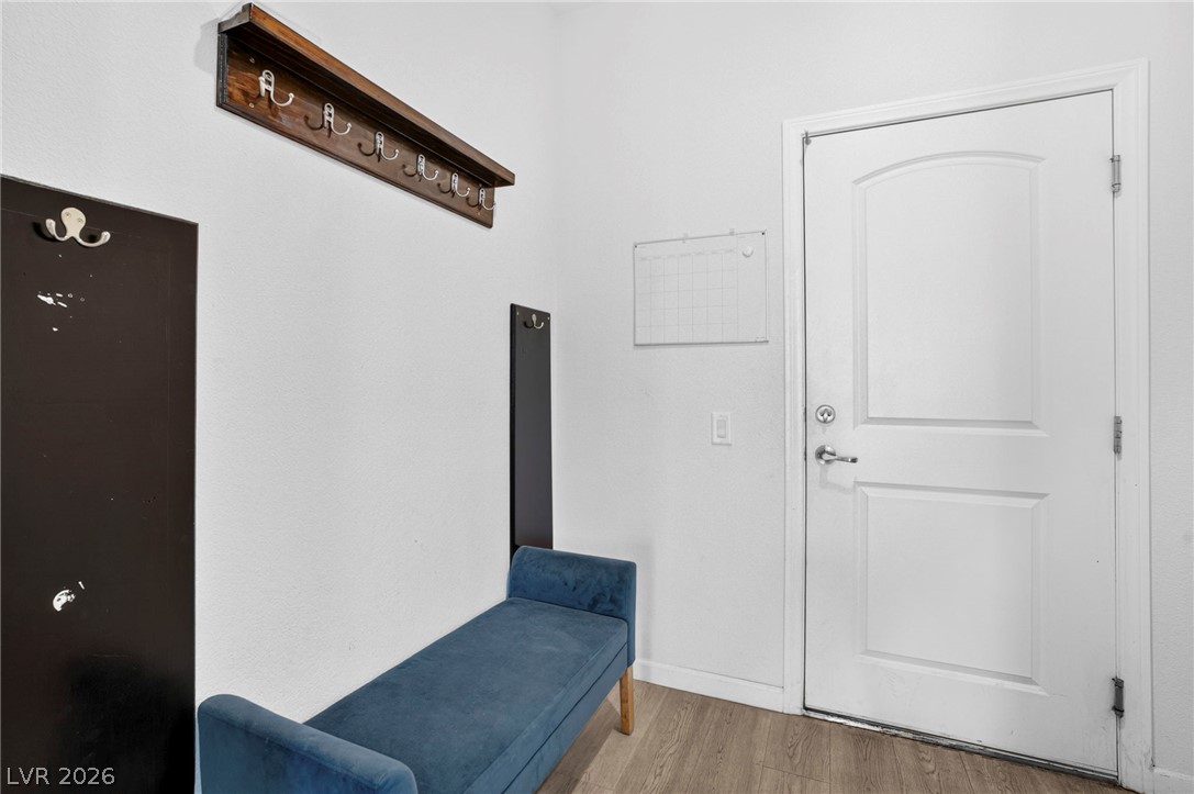 6281 Angora Peak Lane Las Vegas, NV 89115 - Photo 15 of 34 A well-organized entry area offers convenience and style with practical coat hooks and durable flooring.