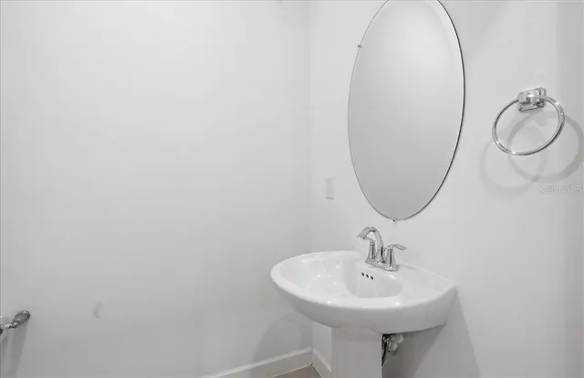 an aerial view of residential houses with outdoor space and swimming pool
