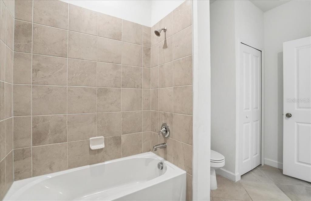 14740 Lyla Terrace Lakewood Ranch, FL 34211 - Photo 25 of 68 a bath tub sitting next to a white toilet
