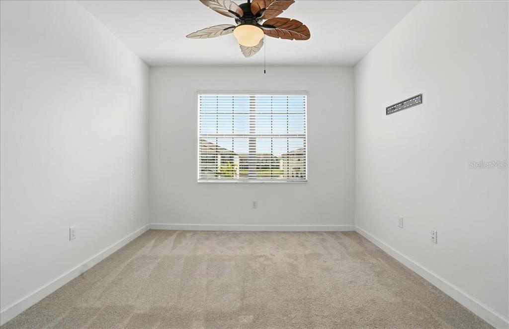 14740 Lyla Terrace Lakewood Ranch, FL 34211 - Photo 28 of 68 an empty room with a window and a fan