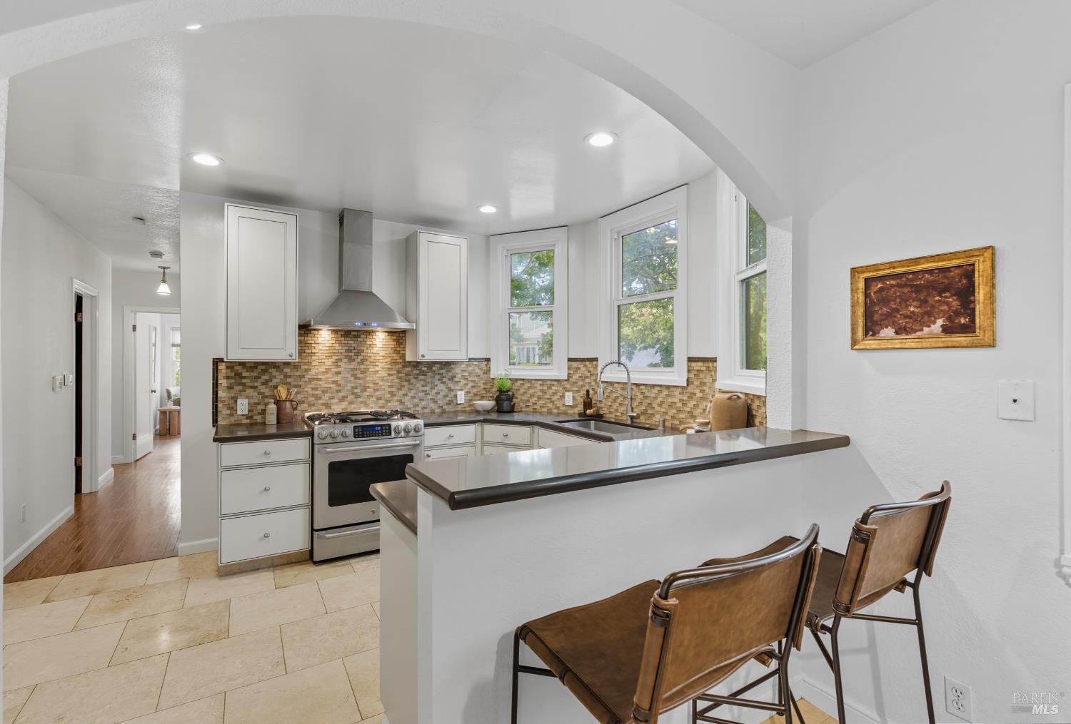 135 H Street San Rafael, CA 94901 - Photo 12 of 21 a kitchen with a sink stove and cabinets