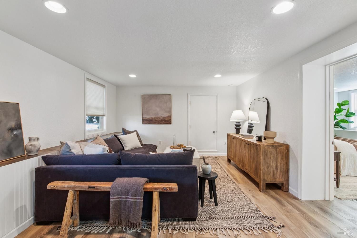 135 H Street San Rafael, CA 94901 - Photo 14 of 21 a living room with furniture a flat screen tv and a table