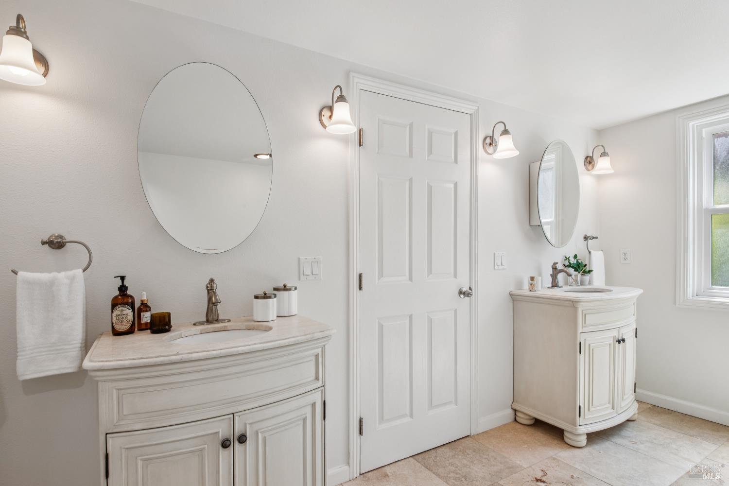 135 H Street San Rafael, CA 94901 - Photo 18 of 21 a bathroom with a sink and a mirror