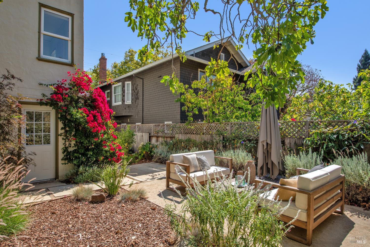 135 H Street San Rafael, CA 94901 - Photo 3 of 21 a view of backyard with a table and chairs and potted plants