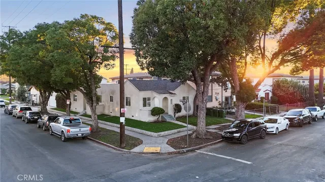 a view of a street with cars