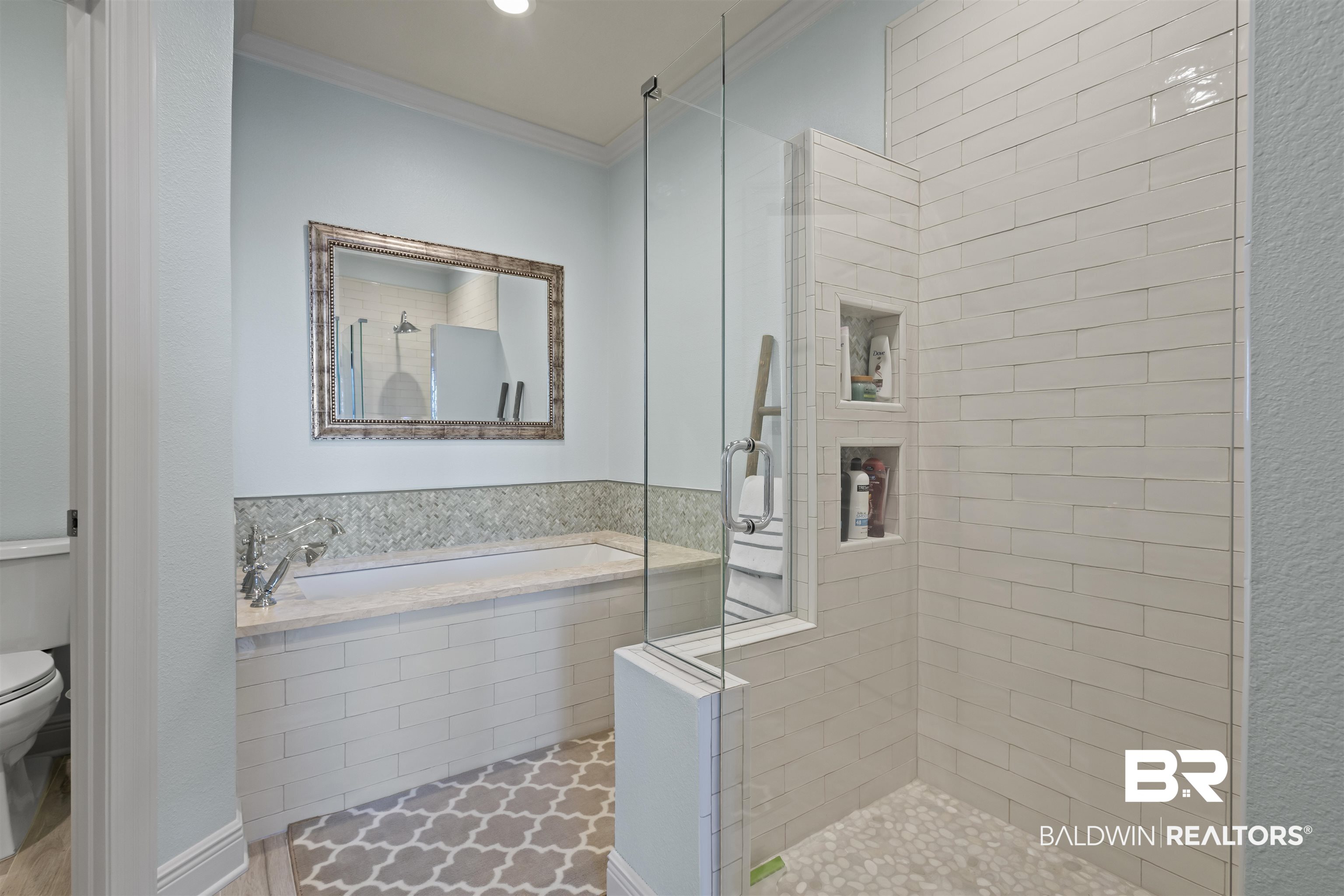 27800 Canal Road, Unit 120 Orange Beach, AL 36561 - Photo 29 of 68 Bathroom with separate shower and tub, crown molding, and toilet