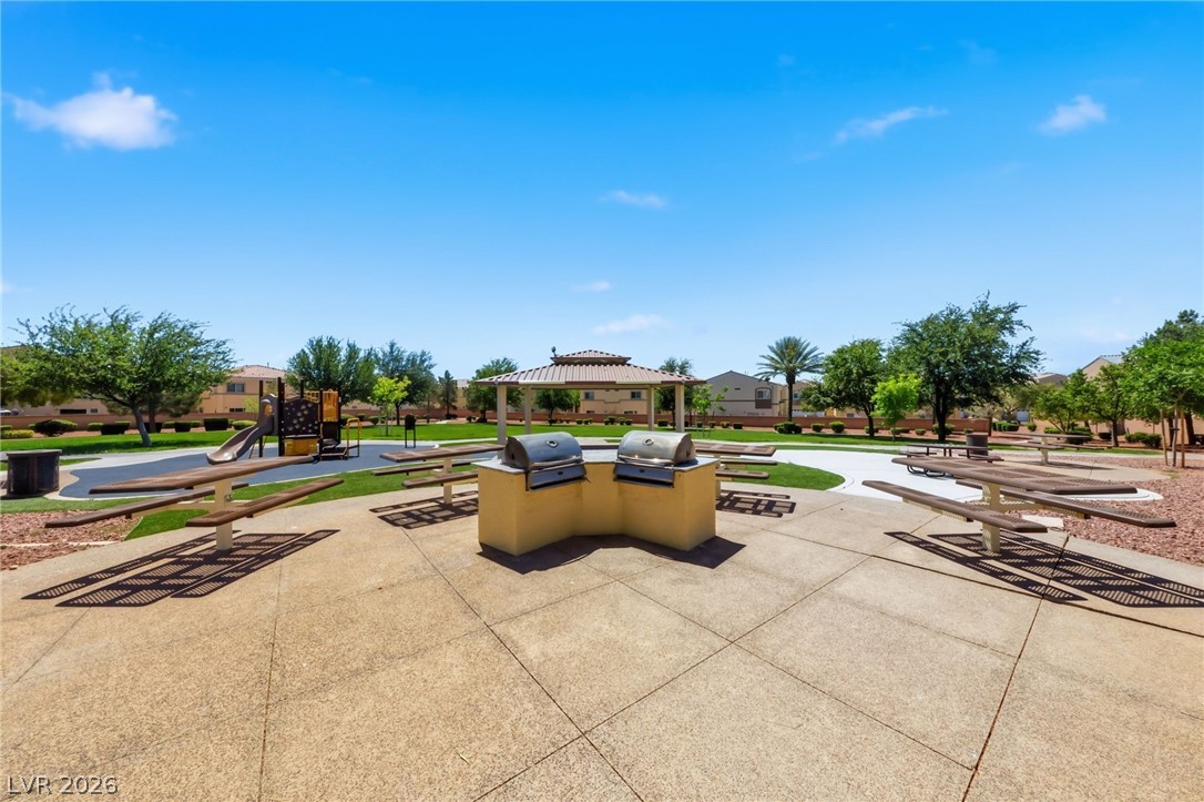 6312 Sandy Ridge Street, Unit 3102 North Las Vegas, NV 89081 - Photo 26 of 31 A community park with built-in barbecues and picnic tables for outdoor enjoyment.
