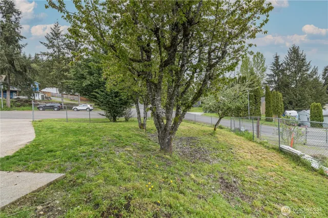 a kitchen with stainless steel appliances a stove a refrigerator and a dining table