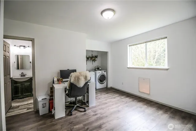a bathroom with a sink a toilet and a mirror