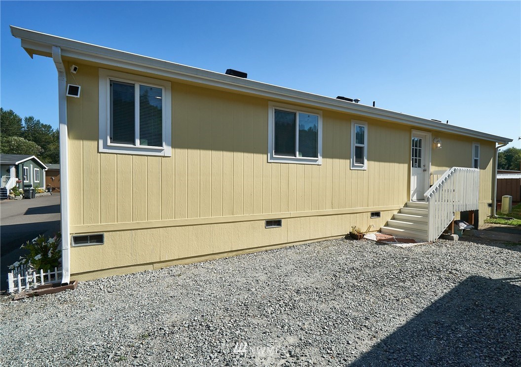 15256 Pine Drive Renton, WA 98058 - Photo 2 of 15 a house with a large window