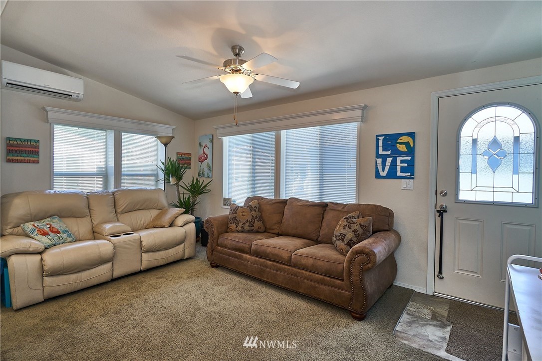15256 Pine Drive Renton, WA 98058 - Photo 8 of 15 a living room with furniture and a large window