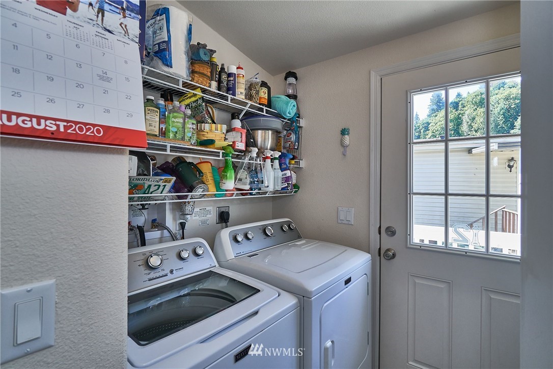 15256 Pine Drive Renton, WA 98058 - Photo 9 of 15 a utility room with dryer and washer