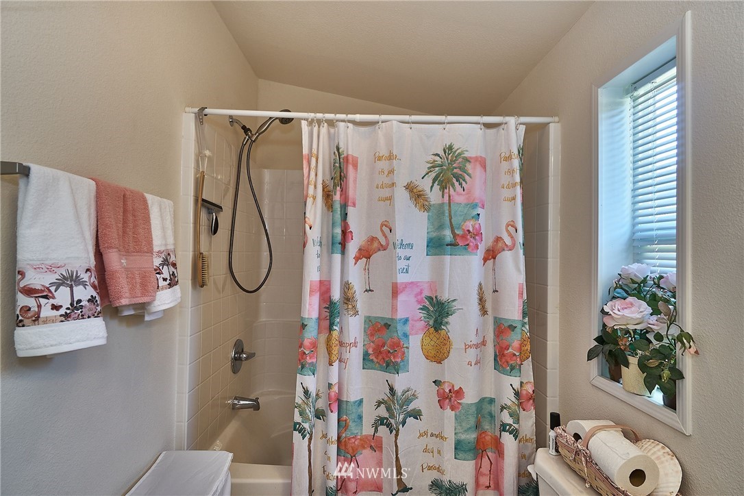 15256 Pine Drive Renton, WA 98058 - Photo 10 of 15 a bathroom with a shower curtain and a curtain
