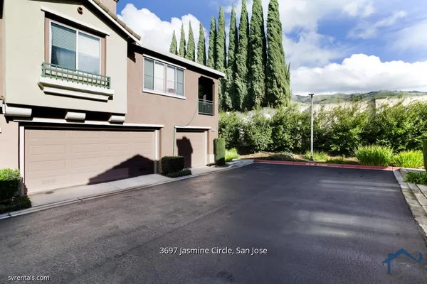 a view of a house with a street