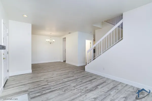 a view of an entryway with wooden floor