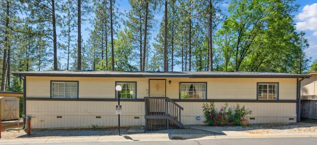 a view of a house with a tree
