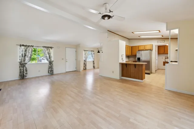 a view of a kitchen with furniture and a window