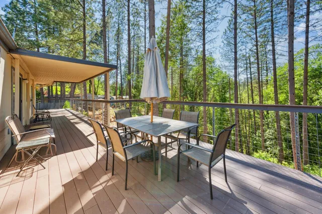 a view of a patio with a table chairs and a table