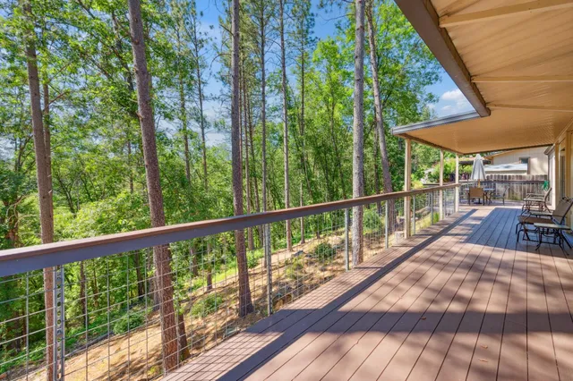 a view of balcony with deck and wooden floor