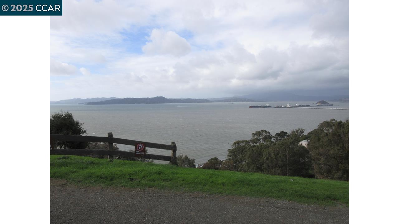 0 Crest Avenue Richmond, CA 94801 - Photo 15 of 30 a view of a lake with a yard and lake in the back
