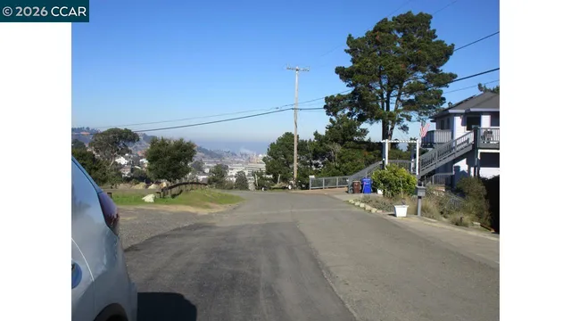 a view of a street with a building in the background