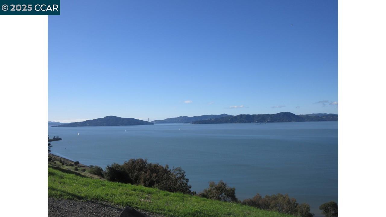 0 Crest Avenue Richmond, CA 94801 - Photo 4 of 30 a view of a lake with a mountain in the background