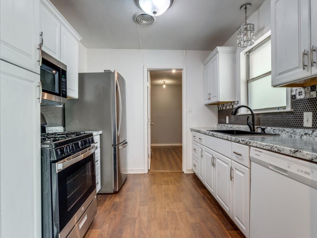 12 Geraldine Lane Denison, TX 75020 - Photo 4 of 12 a kitchen with granite countertop a sink stove and refrigerator