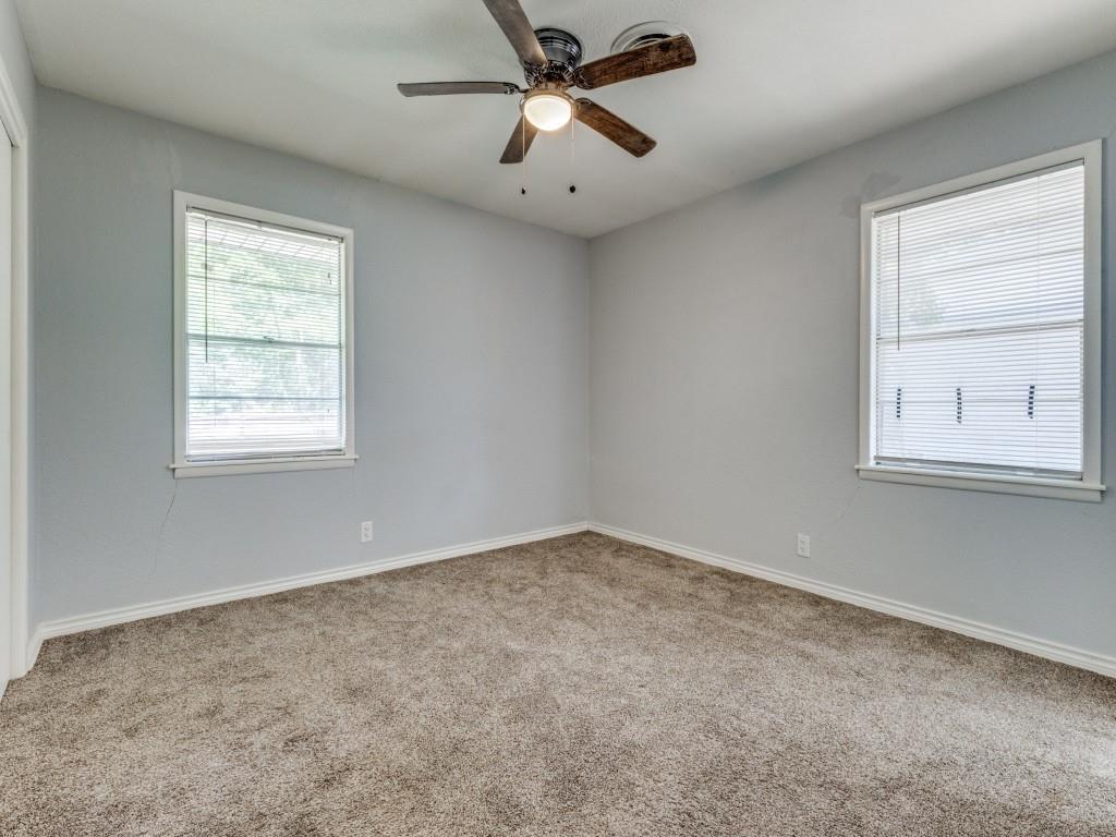12 Geraldine Lane Denison, TX 75020 - Photo 6 of 12 an empty room with windows and fan