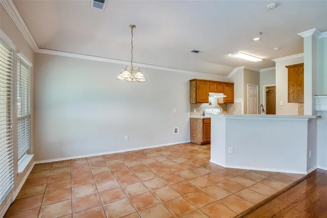 a view of a kitchen with a sink and cabinets