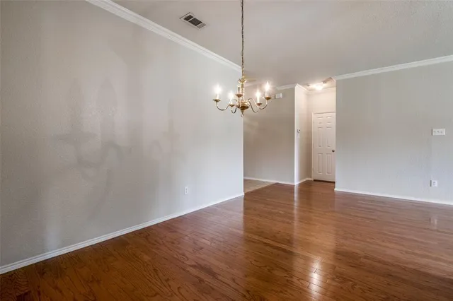 a view of a livingroom with wooden floor