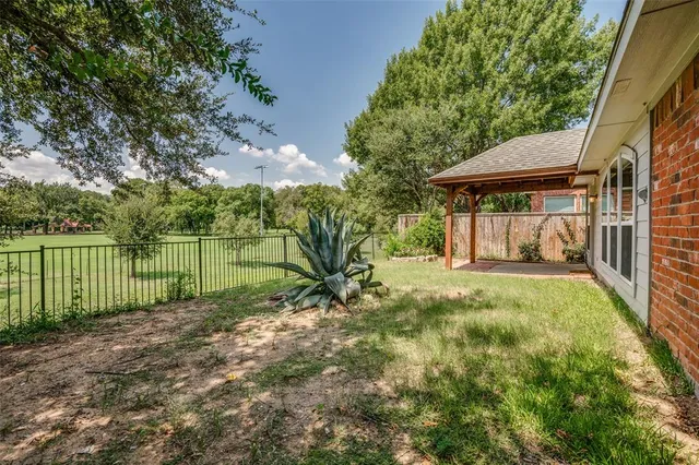 a view of a backyard with a garden
