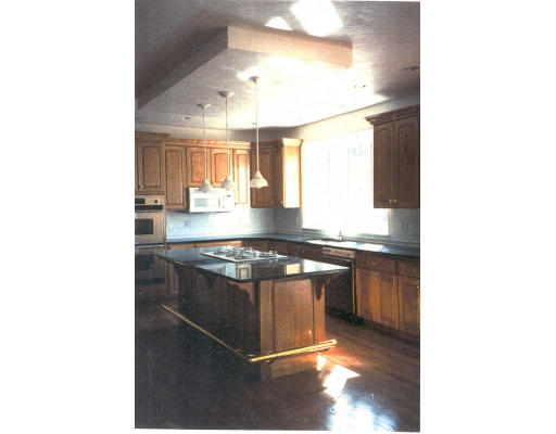 182 Concord Road Wayland, MA 01778 - Photo 4 of 11 a kitchen with granite countertop a sink and a stove