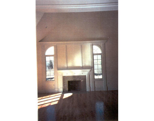 182 Concord Road Wayland, MA 01778 - Photo 5 of 11 a view of a livingroom with a fireplace and window