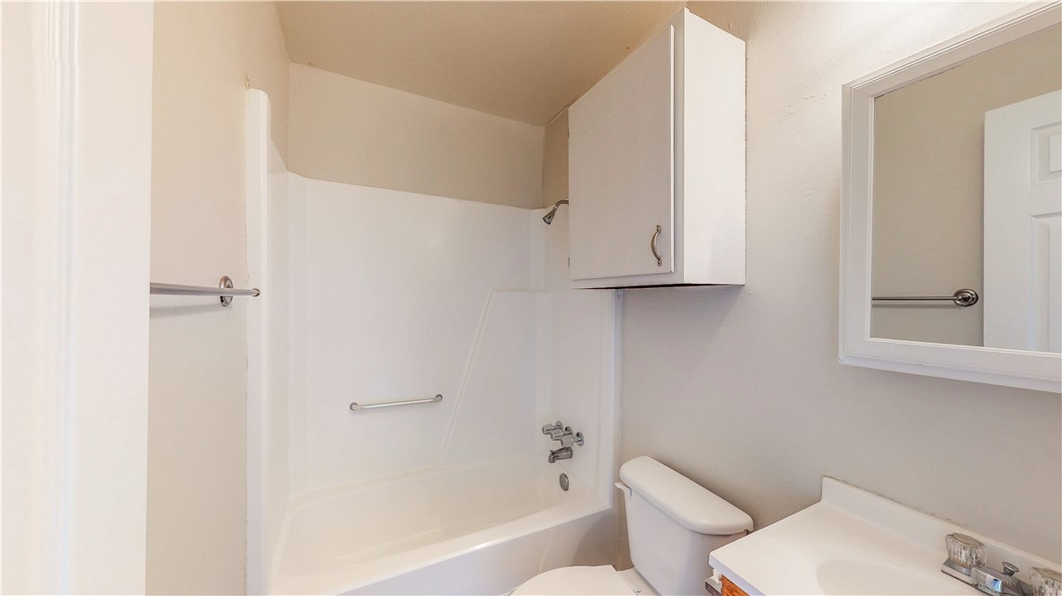 2912 Prairie Flower Circle, Unit D Bryan, TX 77802 - Photo 13 of 22 a bathroom with a toilet and a bathtub