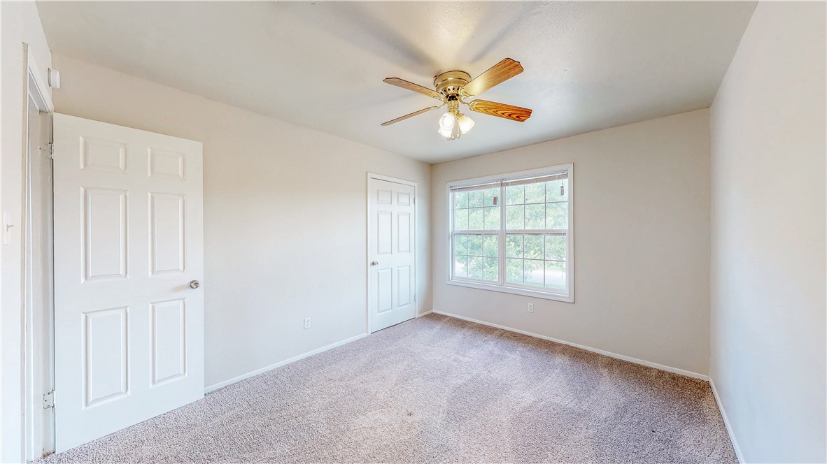2912 Prairie Flower Circle, Unit D Bryan, TX 77802 - Photo 15 of 22 a view of an empty room with a window