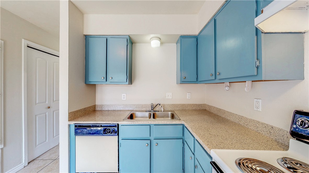2912 Prairie Flower Circle, Unit D Bryan, TX 77802 - Photo 2 of 22 a kitchen with a sink and cabinets