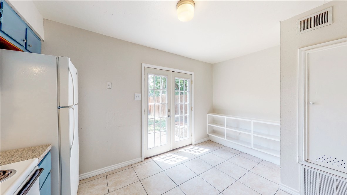 2912 Prairie Flower Circle, Unit D Bryan, TX 77802 - Photo 4 of 22 a view of an empty room with window and cabinet