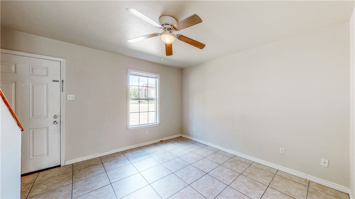 2912 Prairie Flower Circle, Unit D Bryan, TX 77802 - Photo 5 of 22 an empty room with windows and fan