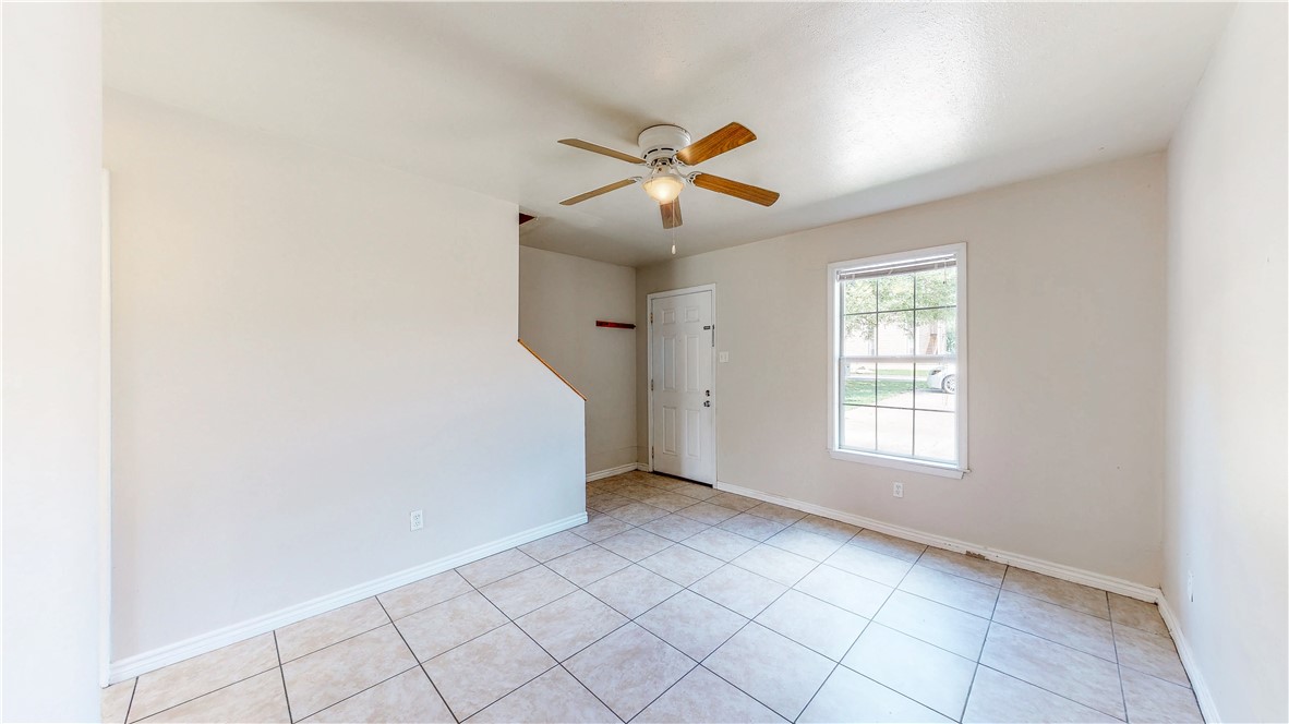 2912 Prairie Flower Circle, Unit D Bryan, TX 77802 - Photo 6 of 22 a view of an empty room with a window