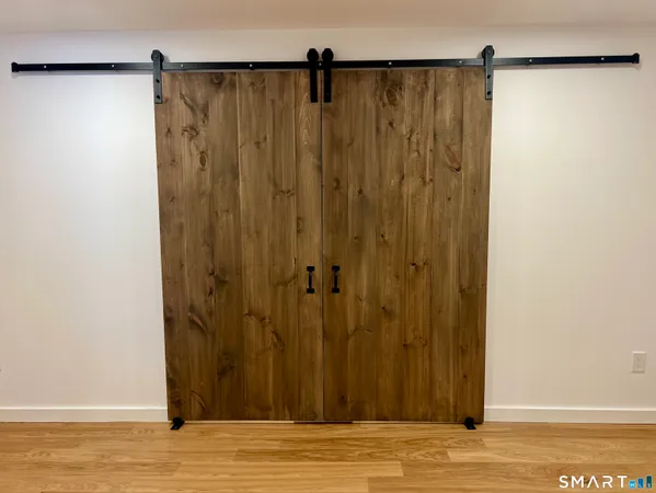 a view of a bathroom with wooden floor