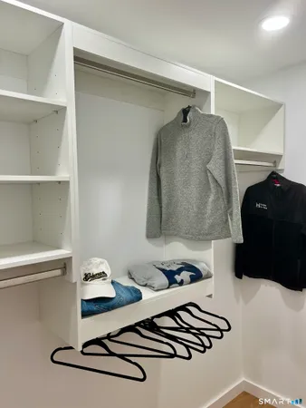 a view of a room with racks on the wall