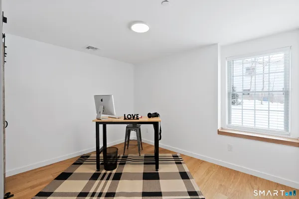 a view of a bedroom from the hallway