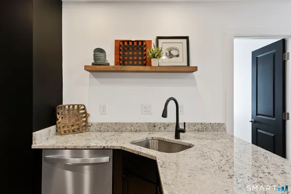 a kitchen with a sink and a refrigerator