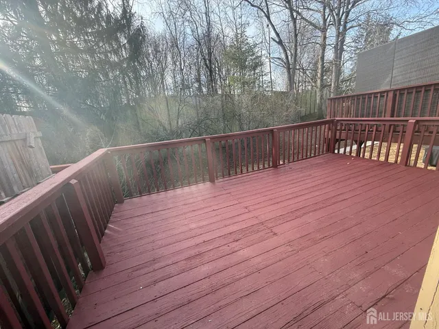 a balcony with wooden floor