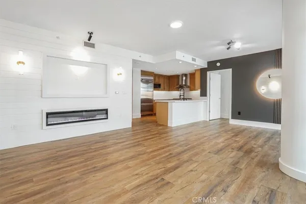 a kitchen with stainless steel appliances a sink and a refrigerator