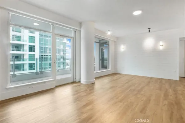 a living room with furniture and large window