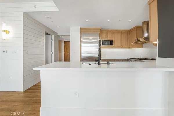 a view of entryway with furniture and a rug