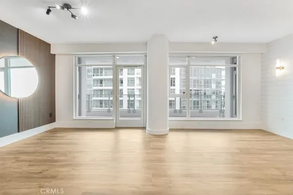 a view of staircase with a rug and a window