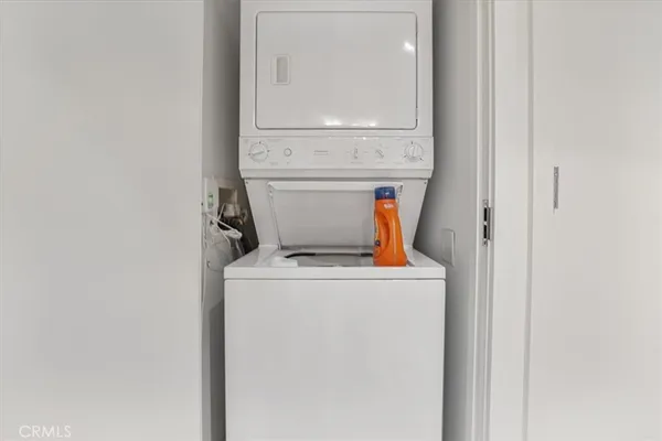 a view of a porch with a table and chairs